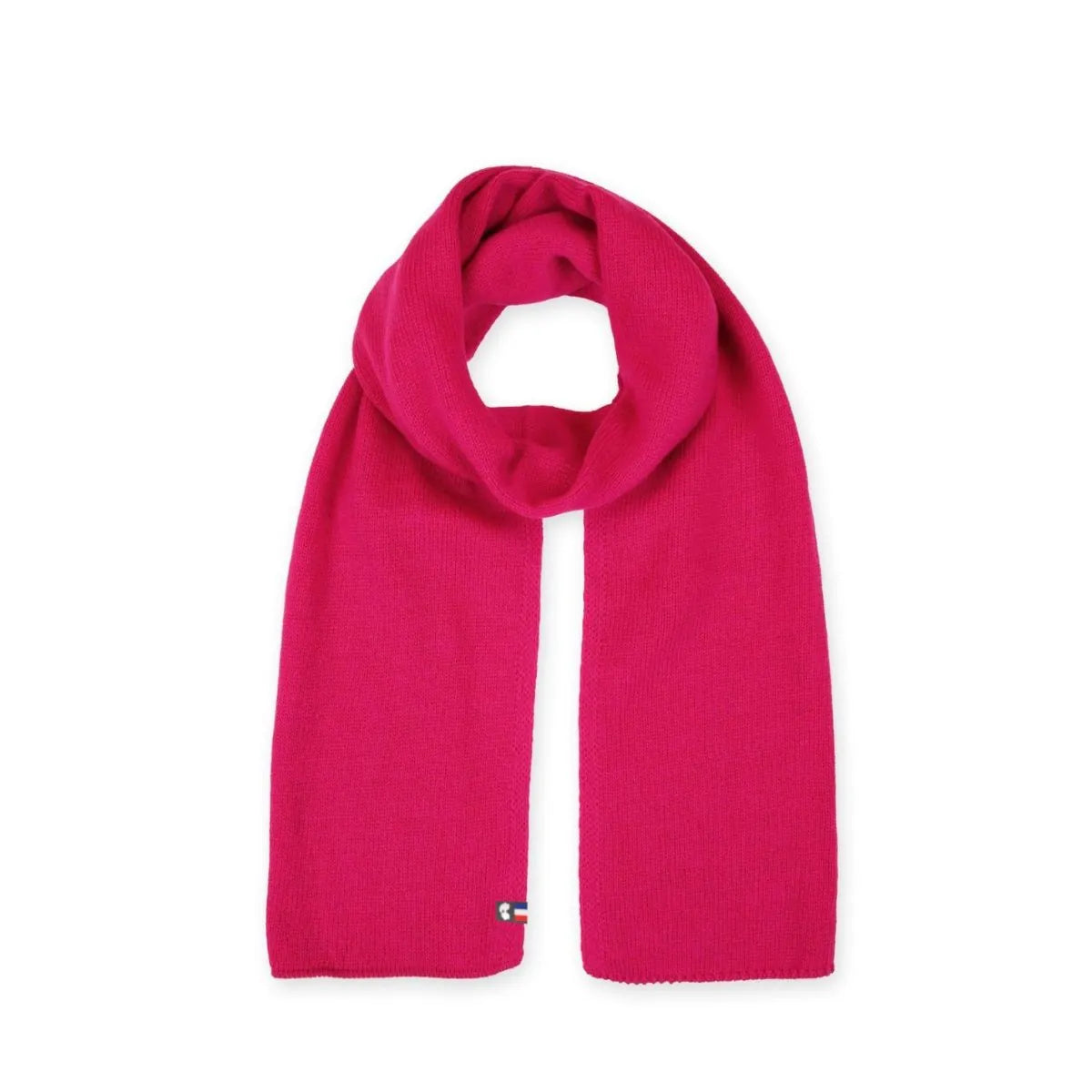 Écharpe femme en laine mérinos fuchsia posée à plat, maille jersey